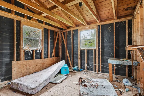 a balcony with furniture and a potted plant