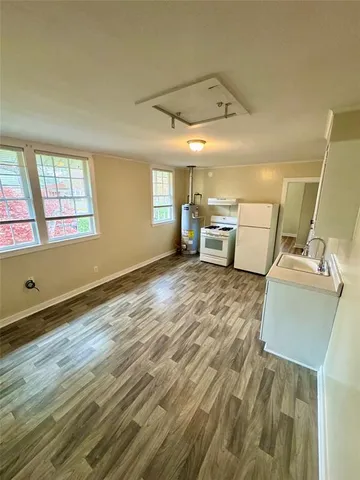 a room with a chair and tables