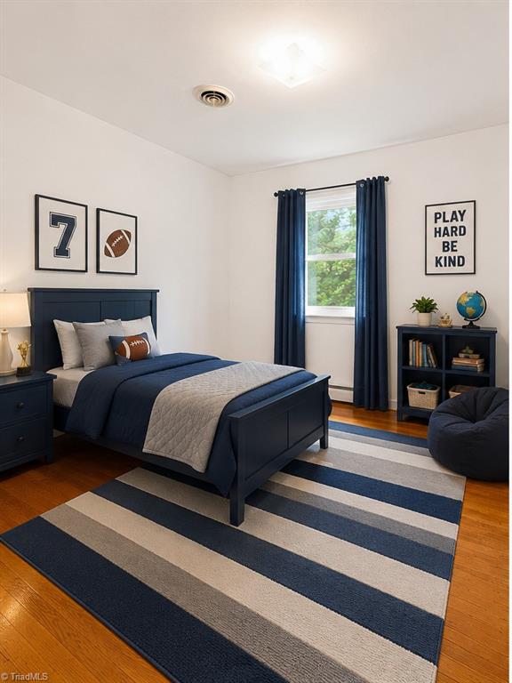 626 Kenneth Road Greensboro, NC 27455 - Photo 17 of 34 Bedroom 1 Digitally enhanced