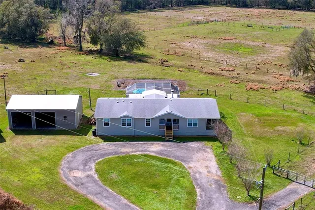 a kitchen with granite countertop a sink and a stove top oven