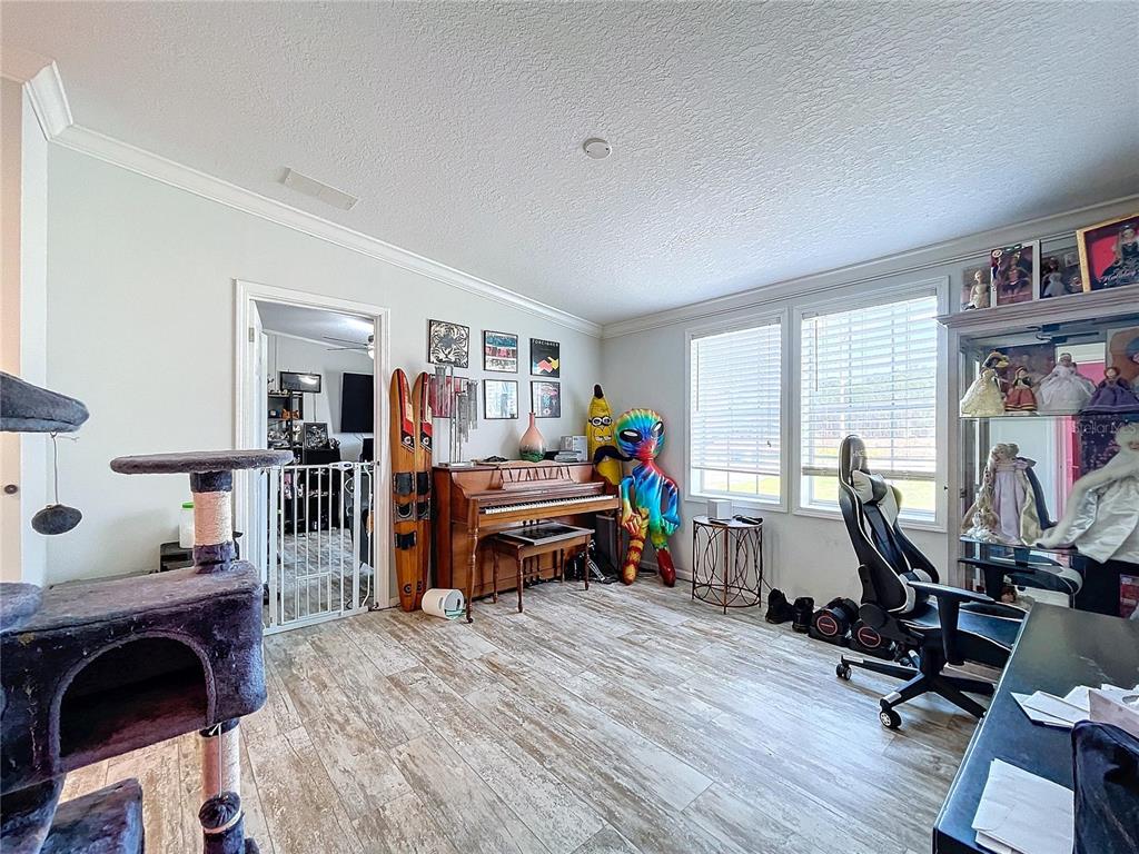 14890 County Road 757 Webster, FL 33597 - Photo 42 of 100 a view of a workspace with furniture and a livingroom