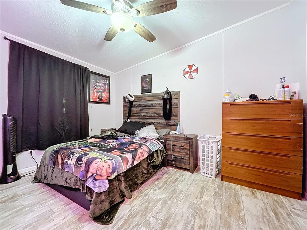 14890 County Road 757 Webster, FL 33597 - Photo 44 of 100 a bedroom with a bed and wooden floor