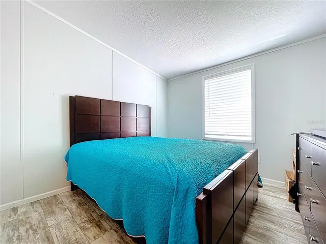 a view of a roof deck with table and chairs a barbeque