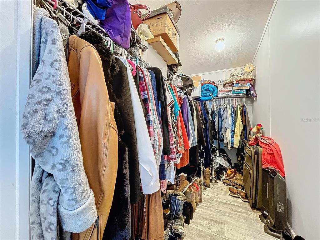 14890 County Road 757 Webster, FL 33597 - Photo 54 of 100 a view of walk in closet with clothes