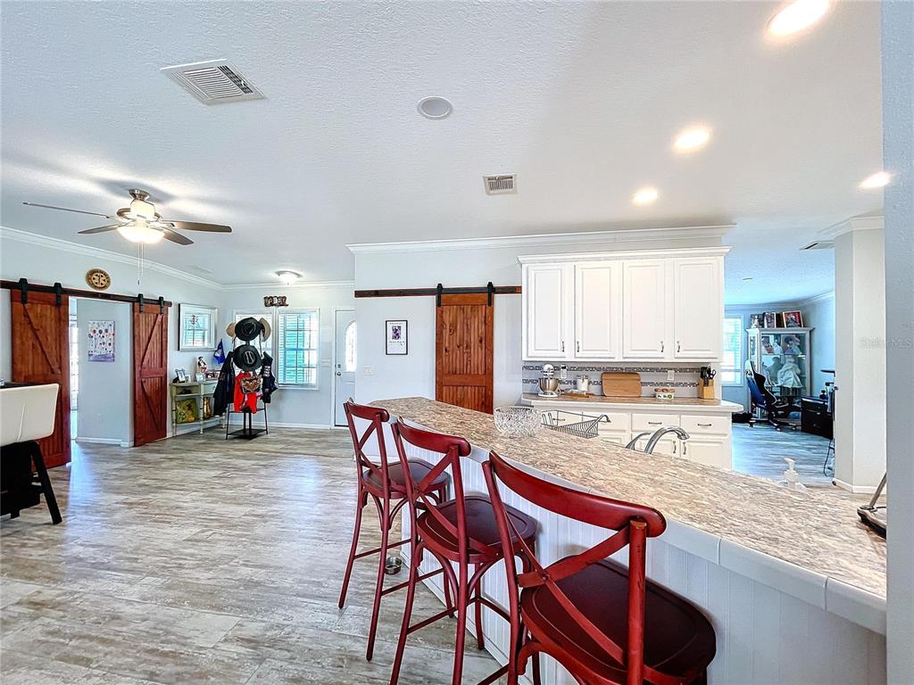 14890 County Road 757 Webster, FL 33597 - Photo 77 of 100 a view of a dining room with furniture and a large window
