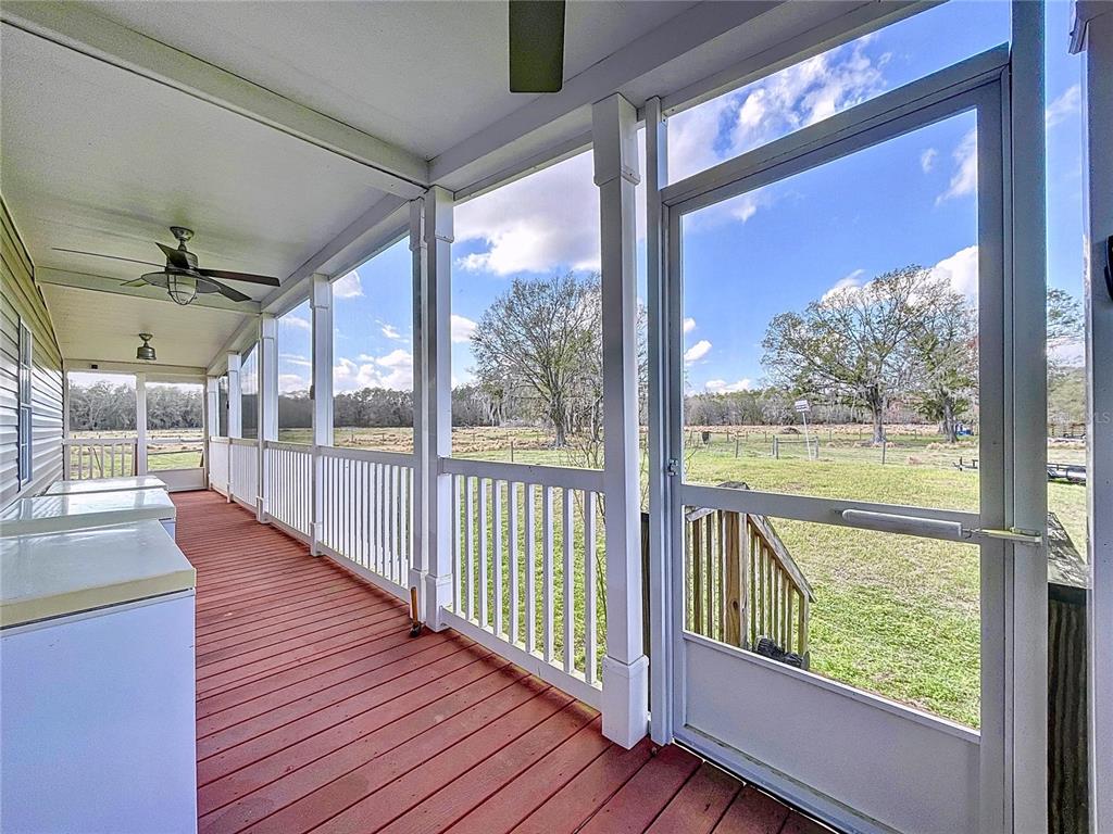 14890 County Road 757 Webster, FL 33597 - Photo 92 of 100 a view of a porch with wooden floor and outdoor space