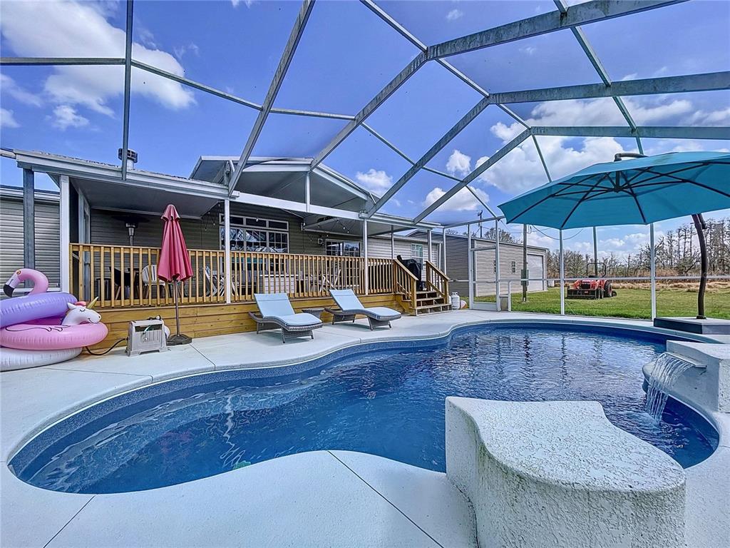14890 County Road 757 Webster, FL 33597 - Photo 96 of 100 a view of a chairs and table in the patio