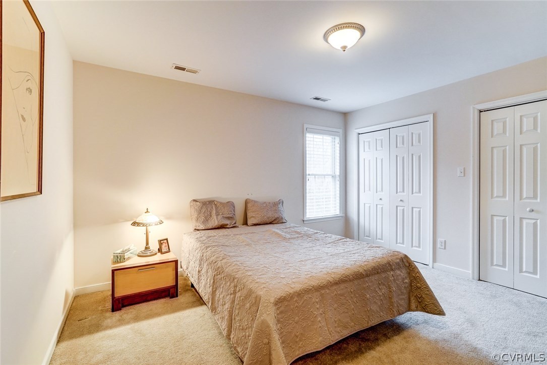 13001 Chipstead Road Chester, VA 23831 - Photo 19 of 31 a bedroom with a bed and a night stand