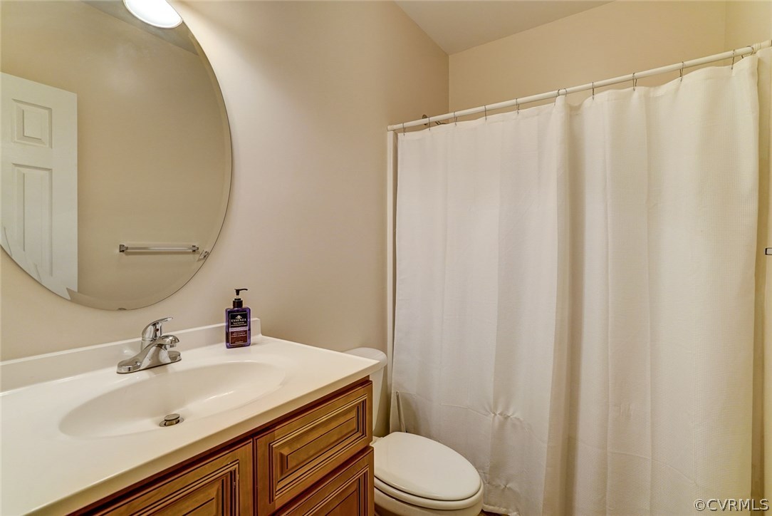 13001 Chipstead Road Chester, VA 23831 - Photo 27 of 31 a bathroom with a sink a toilet and shower
