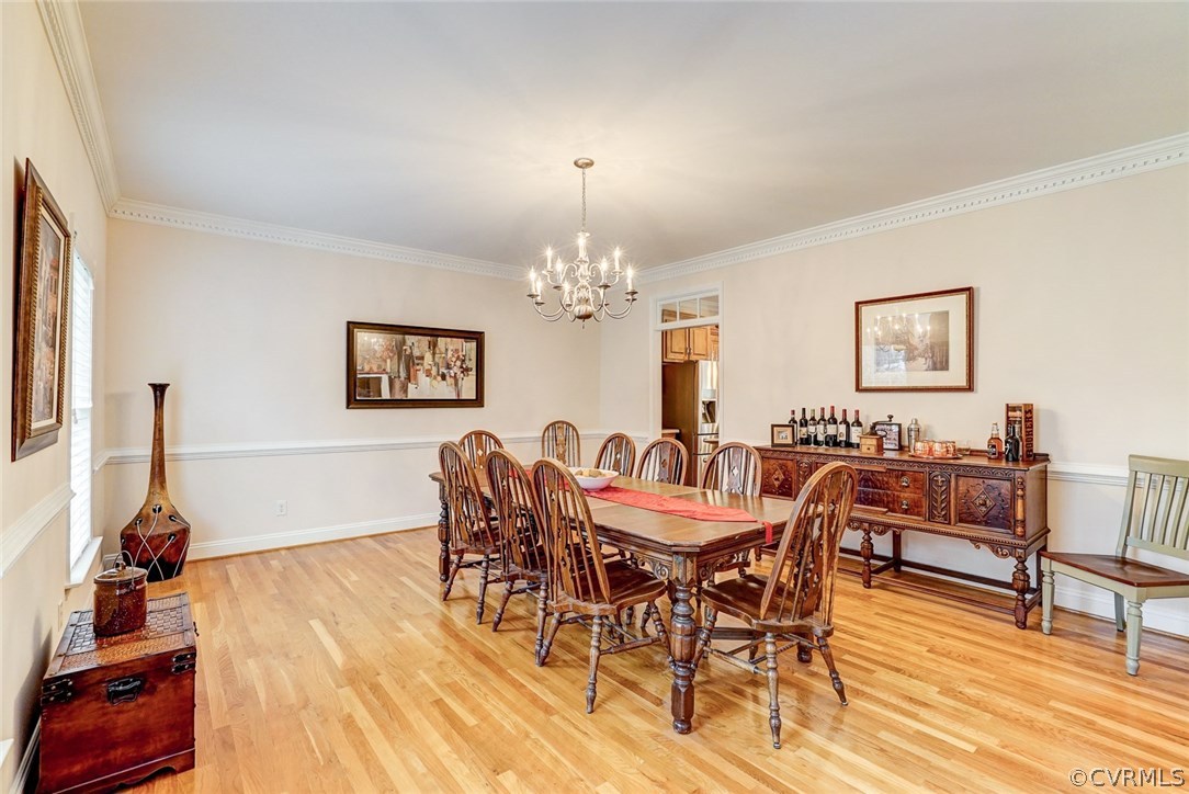 13001 Chipstead Road Chester, VA 23831 - Photo 6 of 31 a view of a dining room with furniture and wooden floor