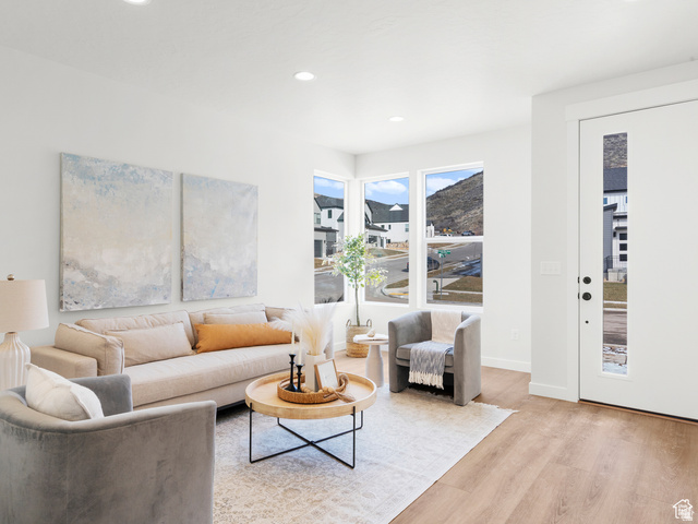 1711 West Canyon Rim Road North Lehi, UT 84048 - Photo 11 of 31 Spacious living area featuring light wood-finish flooring, recessed lighting, and large windows