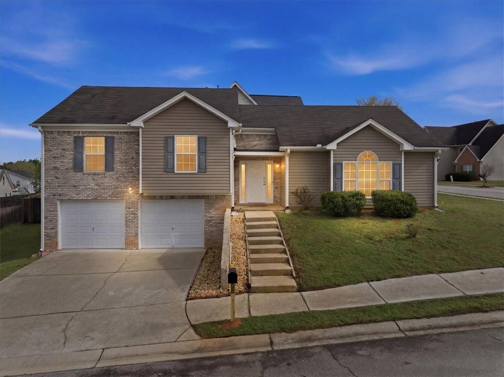 a front view of a house with a yard
