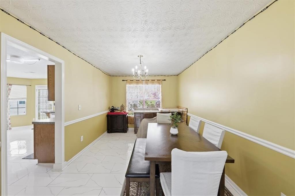 109 Tyler Way Jackson, GA 30233 - Photo 13 of 44 a view of a dining room with furniture window and wooden floor