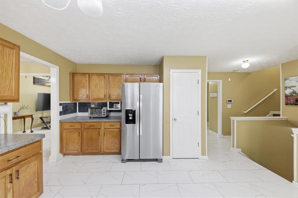109 Tyler Way Jackson, GA 30233 - Photo 15 of 44 a view of a kitchen with furniture and a window
