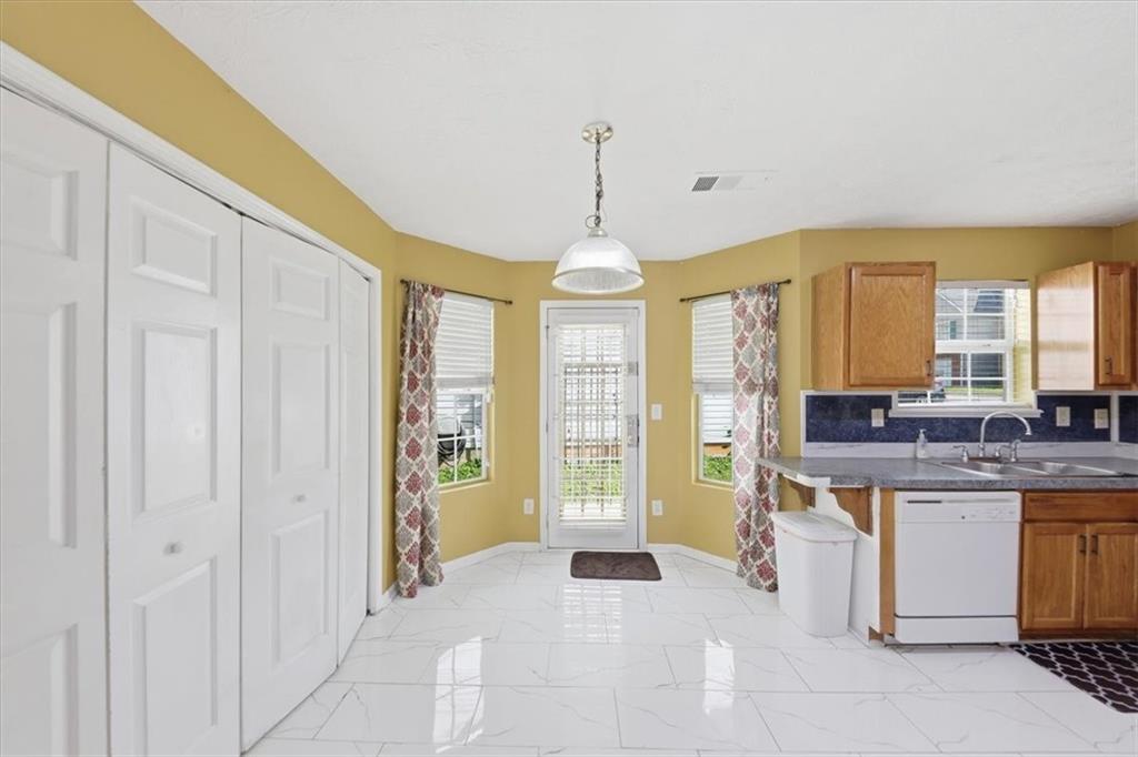 109 Tyler Way Jackson, GA 30233 - Photo 19 of 44 a open kitchen with stainless steel appliances granite countertop a stove and cabinets