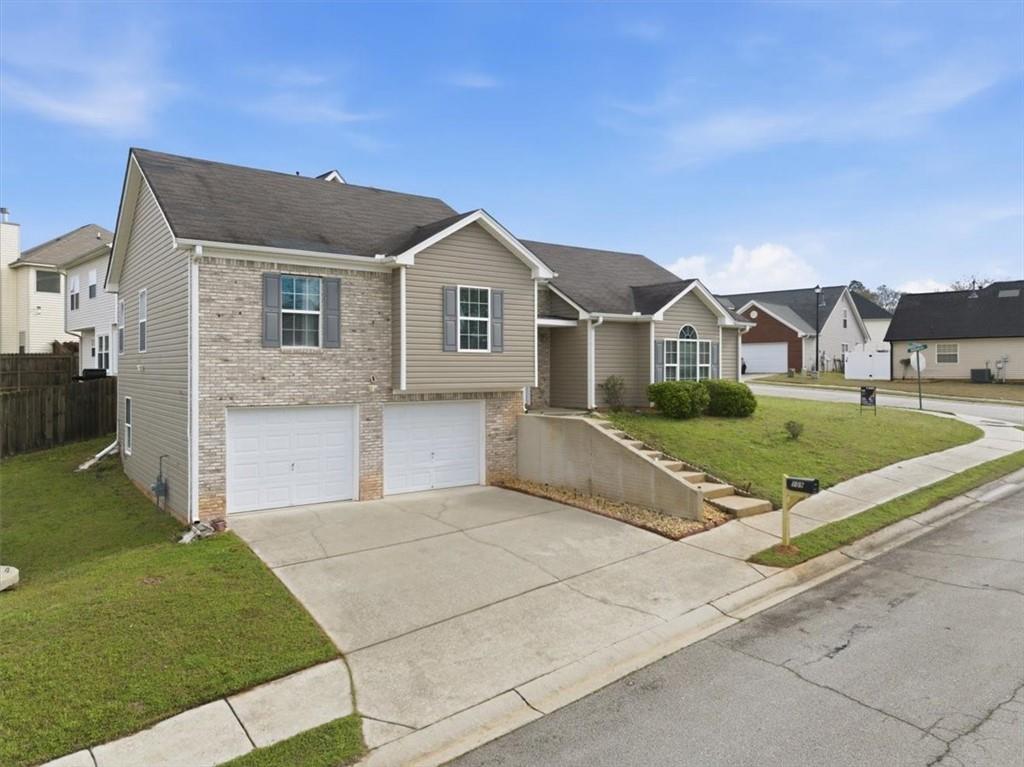 109 Tyler Way Jackson, GA 30233 - Photo 2 of 44 a front view of a house with a yard