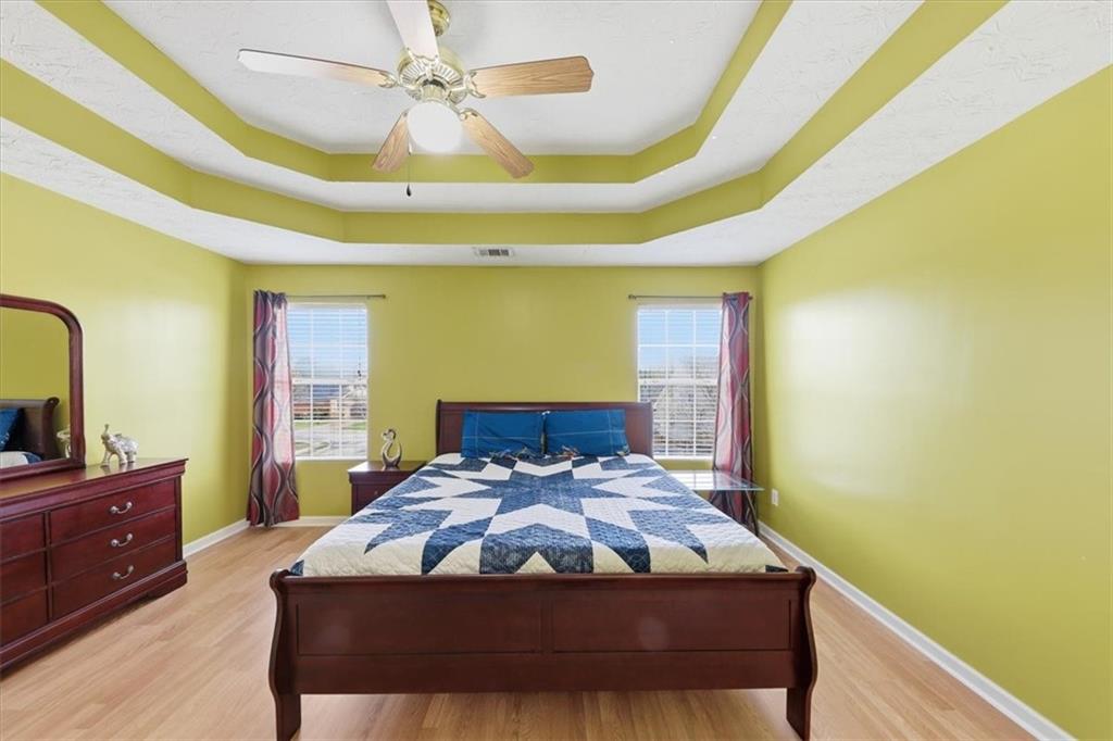 109 Tyler Way Jackson, GA 30233 - Photo 21 of 44 a bedroom with a bed and a dresser