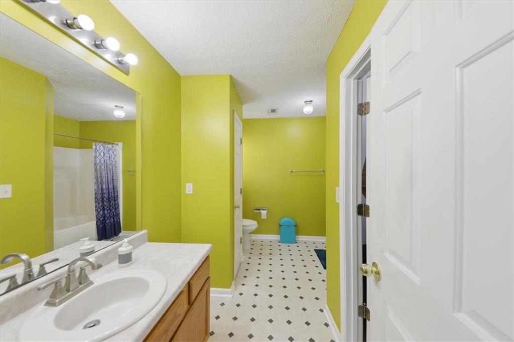 109 Tyler Way Jackson, GA 30233 - Photo 26 of 44 a bathroom with a sink mirror and a shower