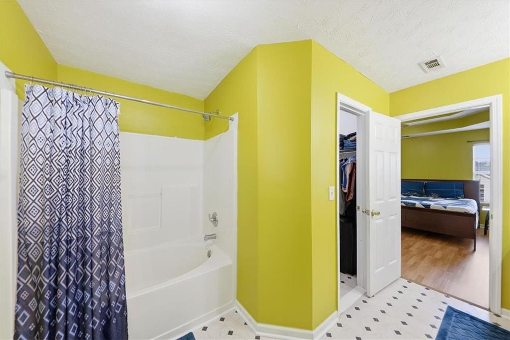 109 Tyler Way Jackson, GA 30233 - Photo 27 of 44 a bathroom with a tub and a shower