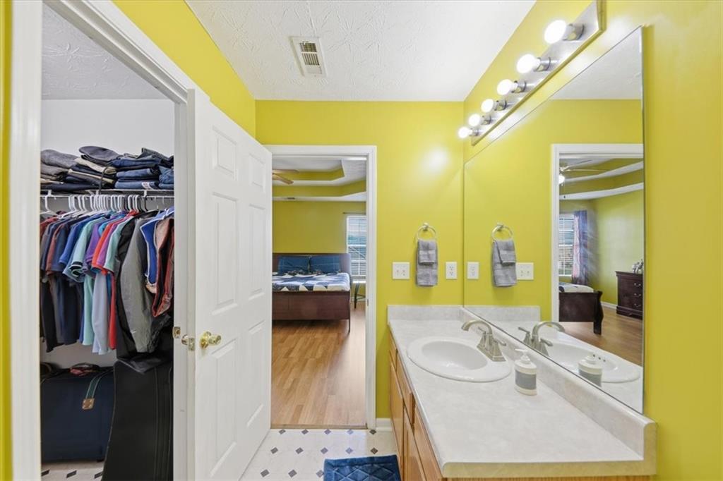 109 Tyler Way Jackson, GA 30233 - Photo 28 of 44 a en suite bathroom with a double vanity sink and a mirror