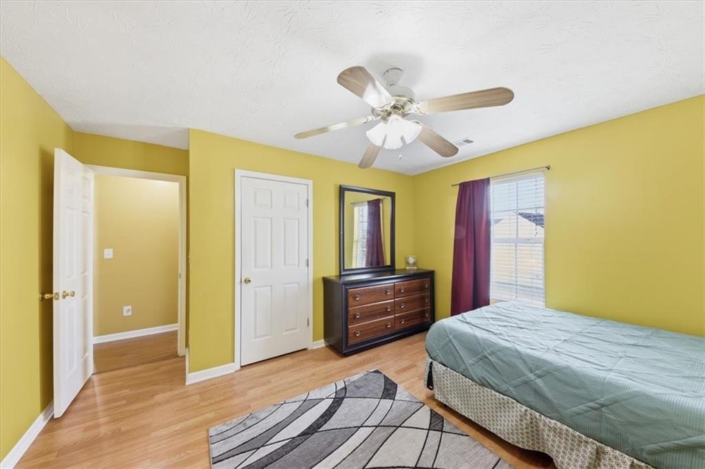 109 Tyler Way Jackson, GA 30233 - Photo 32 of 44 a bedroom with a bed dresser and a window