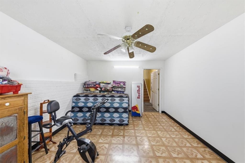 109 Tyler Way Jackson, GA 30233 - Photo 35 of 44 a view of workspace with wooden floor and ceiling fan