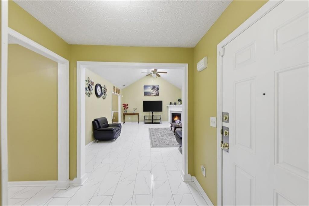 109 Tyler Way Jackson, GA 30233 - Photo 6 of 44 a view of living room with furniture and a flat screen tv