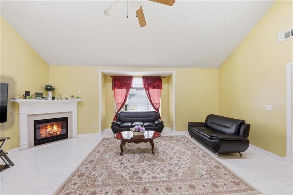 109 Tyler Way Jackson, GA 30233 - Photo 10 of 44 a living room with furniture and a fireplace