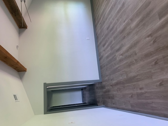 1501 North Burleson Street Kyle, TX 78640 - Photo 10 of 33 a view of a room with wooden floor