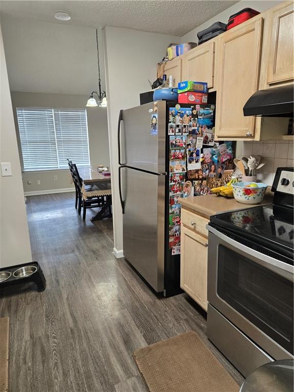 17 Benfield Circle Southeast Cartersville, GA 30121 - Photo 12 of 23 a kitchen with a refrigerator and a stove top oven