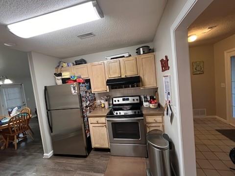 17 Benfield Circle Southeast Cartersville, GA 30121 - Photo 13 of 23 a kitchen with a refrigerator and a stove top oven