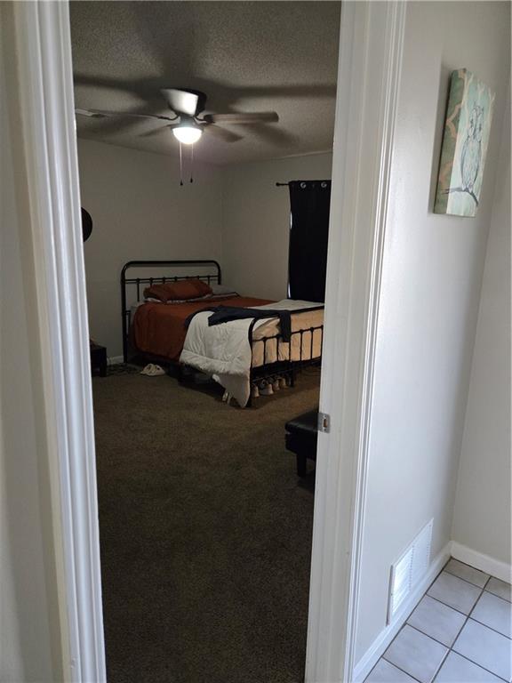 17 Benfield Circle Southeast Cartersville, GA 30121 - Photo 6 of 23 a bedroom with a bed and a mirror