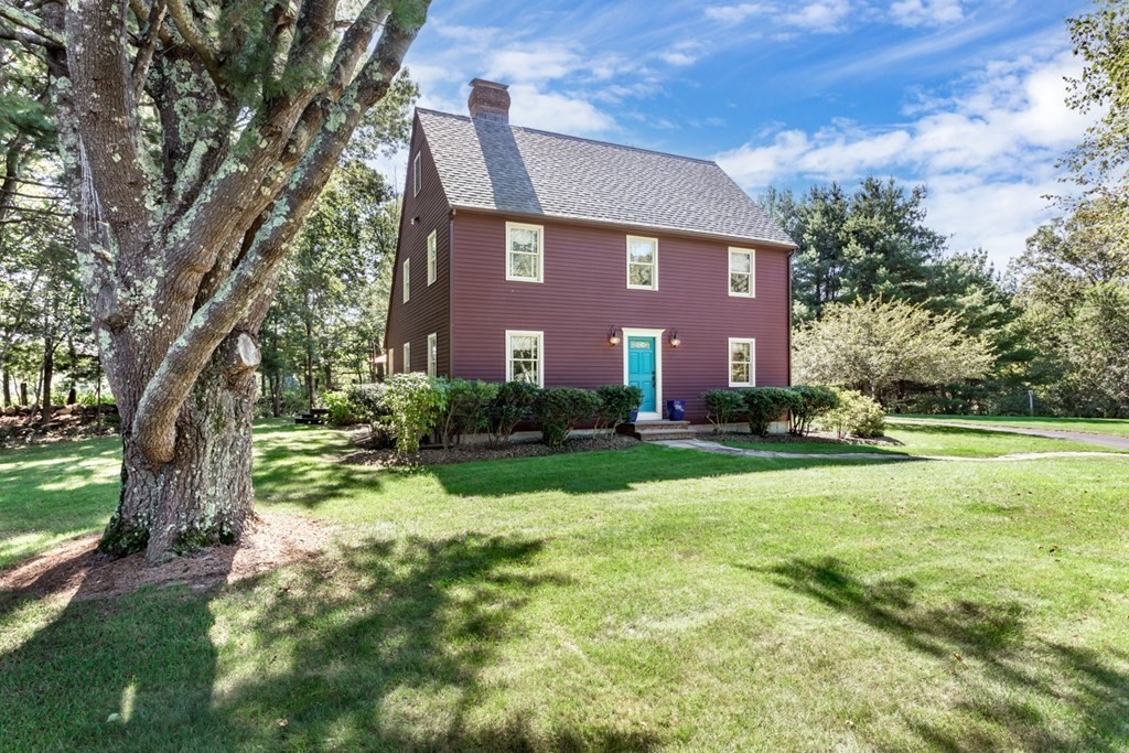 8 Mill River Drive Mendon, MA 01756 - Photo 2 of 42 a front view of house with yard and trees
