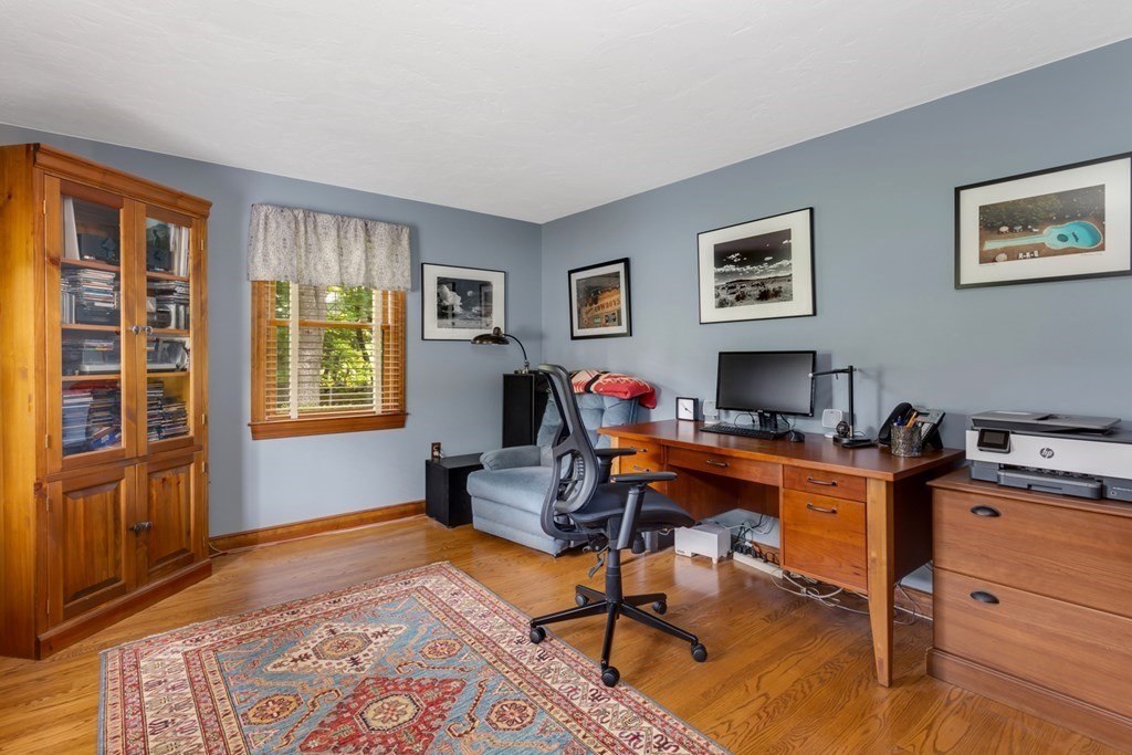 8 Mill River Drive Mendon, MA 01756 - Photo 22 of 42 a view of a workspace with furniture and a window
