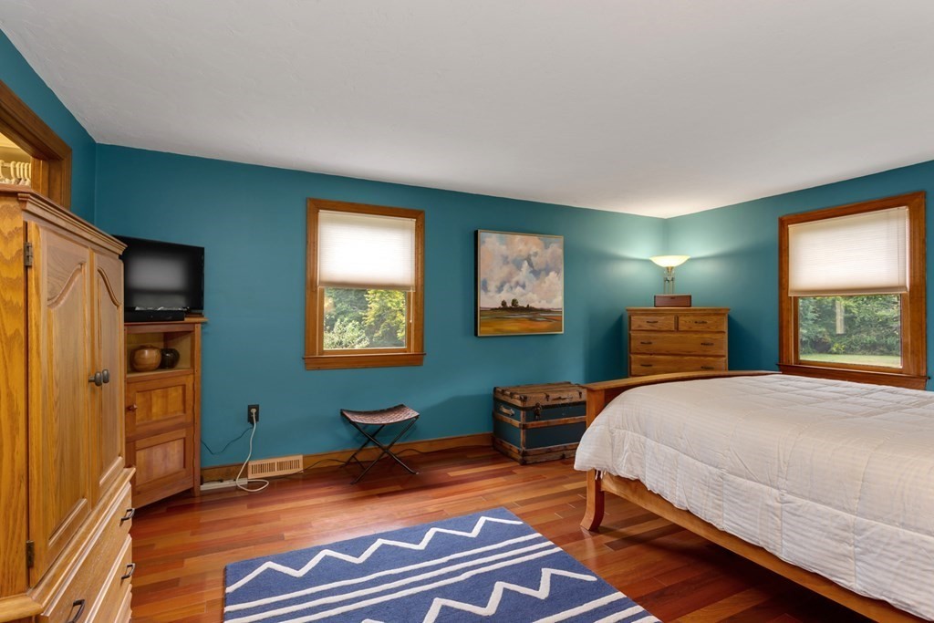 8 Mill River Drive Mendon, MA 01756 - Photo 24 of 42 a bedroom with a bed and wooden floor