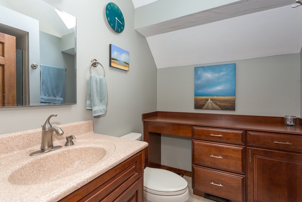 8 Mill River Drive Mendon, MA 01756 - Photo 26 of 42 a bathroom with a granite countertop toilet sink and mirror