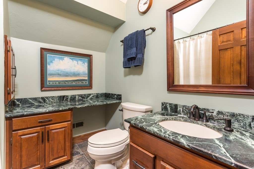 8 Mill River Drive Mendon, MA 01756 - Photo 33 of 42 a bathroom with a granite countertop toilet sink and mirror