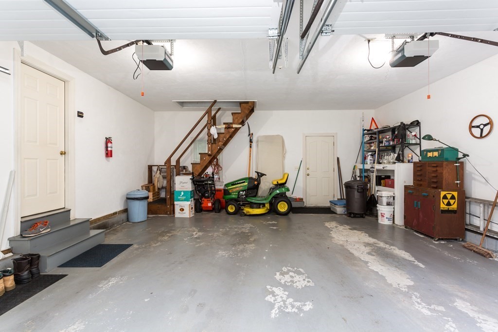 8 Mill River Drive Mendon, MA 01756 - Photo 35 of 42 a view of a garage with a bike and car