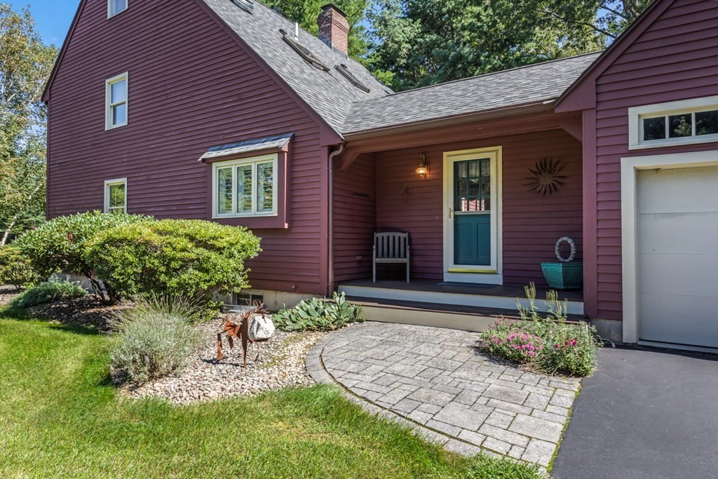 8 Mill River Drive Mendon, MA 01756 - Photo 4 of 42 a front view of a house with garden