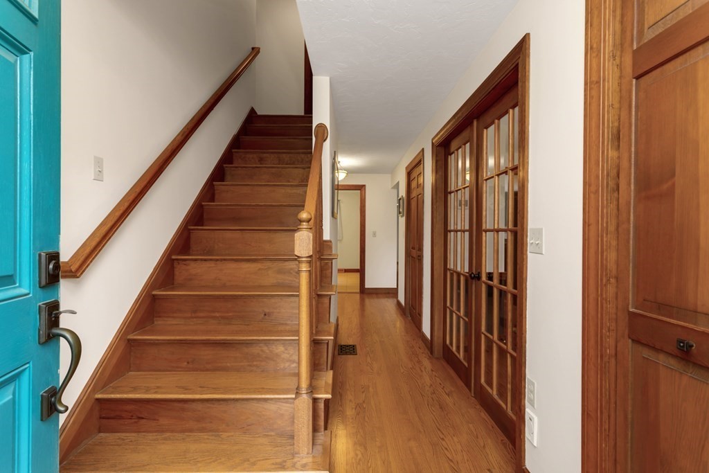8 Mill River Drive Mendon, MA 01756 - Photo 5 of 42 a view of staircase with lots of frames on wall and a window