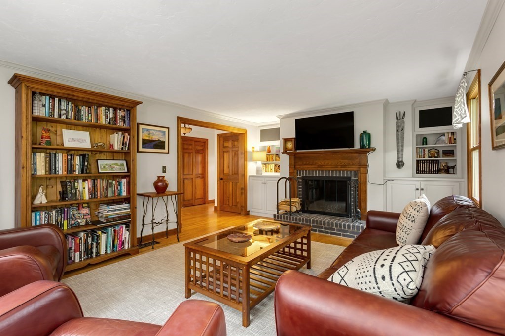 8 Mill River Drive Mendon, MA 01756 - Photo 9 of 42 a living room with furniture fireplace and a flat screen tv