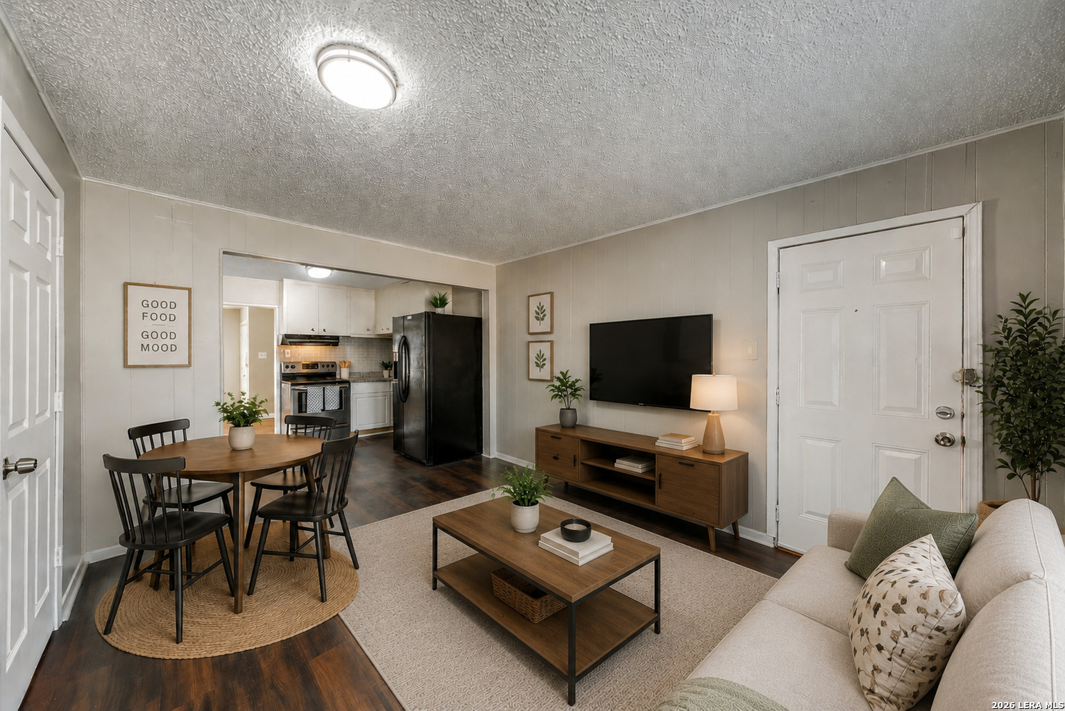 2307 Basse Road San Antonio, TX 78213 - Photo 6 of 17 a living room with furniture and a flat screen tv
