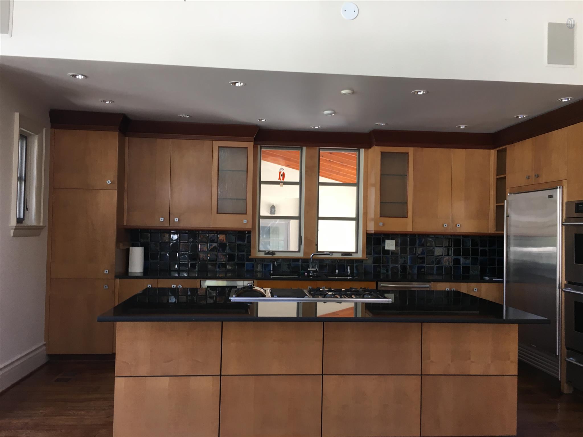 1002 Tyne Boulevard Nashville, TN 37220 - Photo 3 of 4 a kitchen with stainless steel appliances granite countertop a sink a stove and a refrigerator