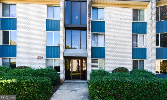 a front view of house and yard with green space