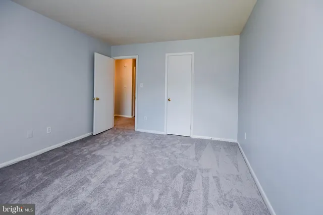 a view of a bathroom from a hallway