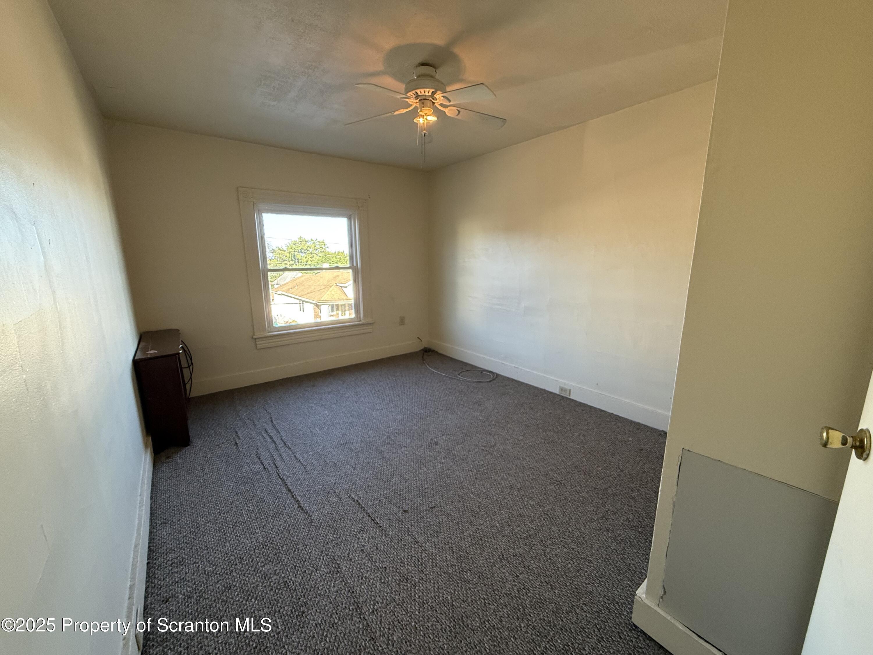 1315 Farr Street, Unit 2 Scranton, PA 18504 - Photo 11 of 14 an empty room with windows and fan