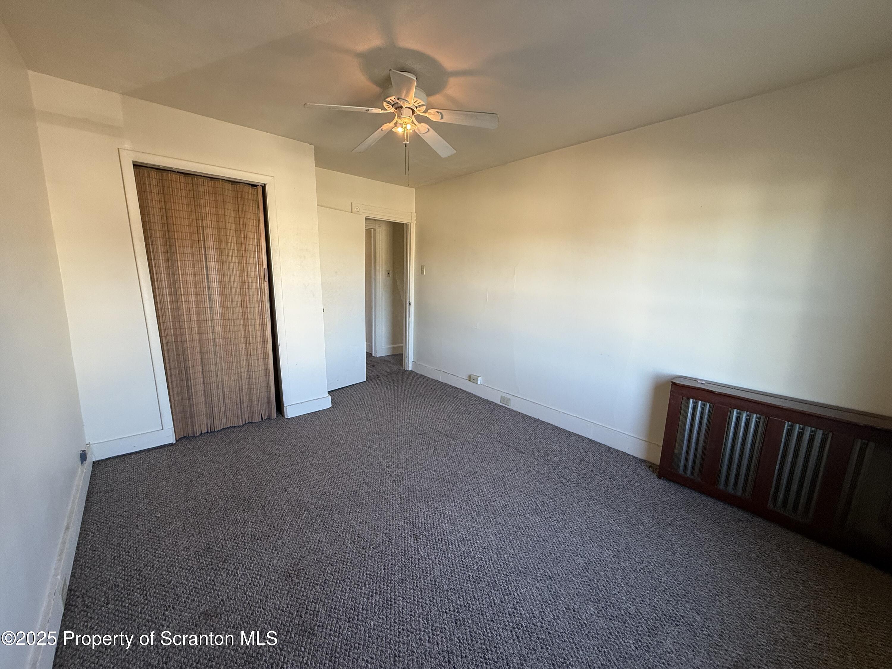 1315 Farr Street, Unit 2 Scranton, PA 18504 - Photo 12 of 14 a view of a hallway with a chandelier