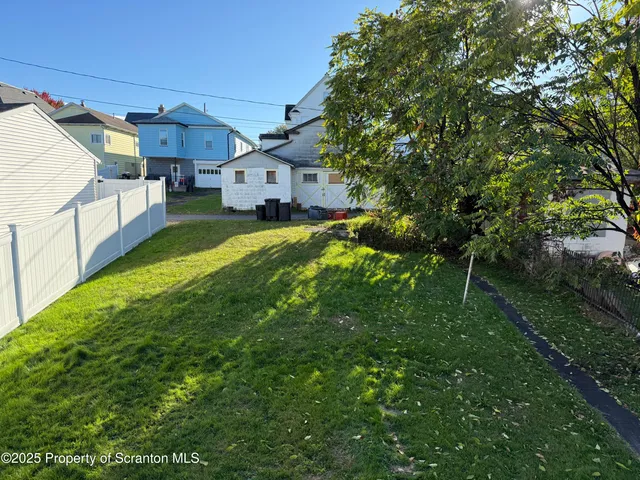 a view of a back yard of the house