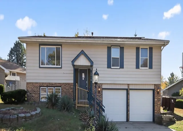 a view of a house with a sink and wooden fence