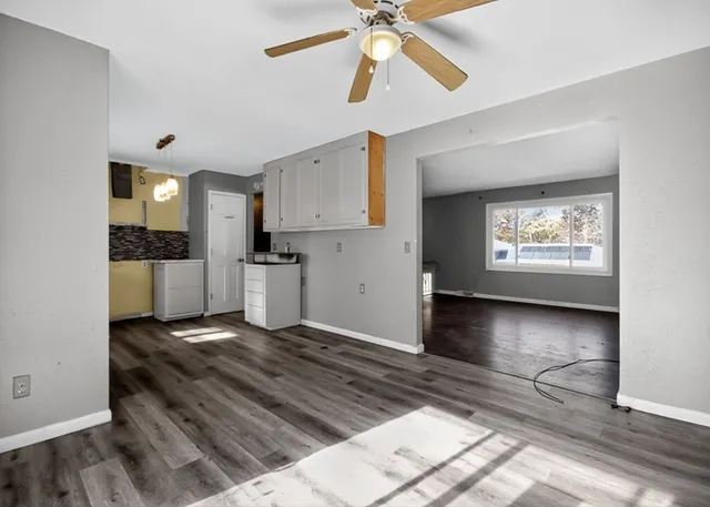 a view of a kitchen with a sink and a window